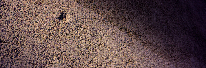 Wall plaster surface and shadow.