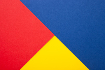 Red, blue and yellow paper texture as background with place for text