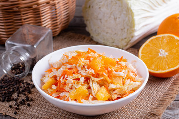 Fresh cabbage salad with oranges and carrots