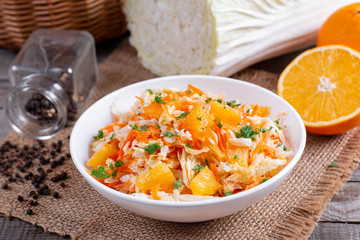 Fresh cabbage salad with oranges and carrots