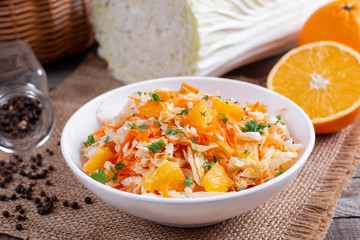 Fresh cabbage salad with oranges and carrots