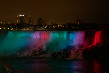 Colorful and bright long exposure of Illuminated American Falls in Niagara Falls at night