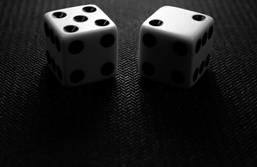 two dice on a black background