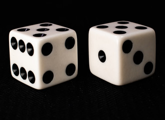 two dice on a black background