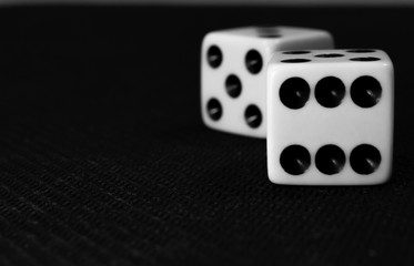 two dice on a black background