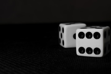 two dice on a black background