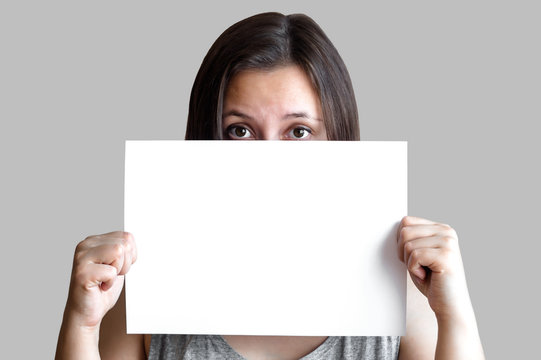 Young Caucasian Woman Holding Blank Paper Sheet Over, Isolated