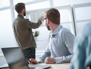 close up. employees of the company are working on a new project