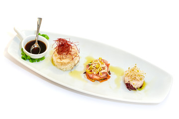 Mixed plate of raw fish, oysters and shrimp tartare