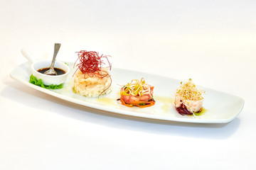 Mixed plate of raw fish, oysters and shrimp tartare