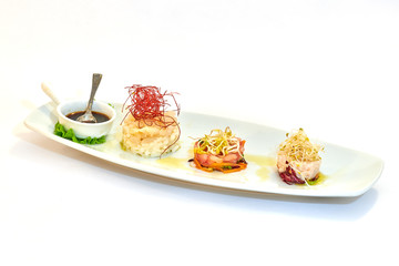 Mixed plate of raw fish, oysters and shrimp tartare