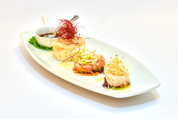 Mixed plate of raw fish, oysters and shrimp tartare