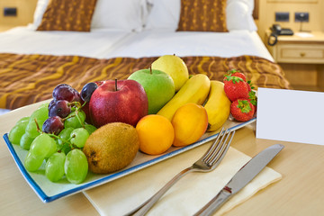 complimentary fruit basket in the hotel room,with free space for the welcome message