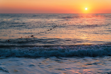 Fototapeta na wymiar Beautiful sunrise on the sea coast in a storm