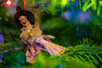 Naklejka premium Vintage toys on a Christmas tree close-up, holiday traditions. Small depth of field