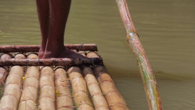 foot in canoa in the river 