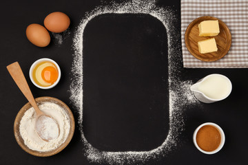 Flat lay composition with eggs and other ingredients on black table, space for text. Baking pie