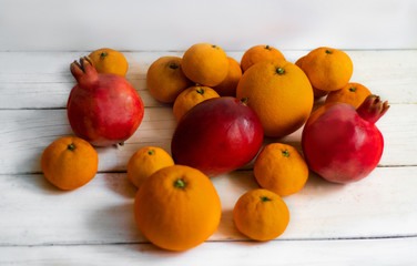 Fruit. Orange, pomegranate, mandarin, mango. Fruit on a white background. Eco-friendly fruits, zero waste.