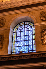 A stained glass window in a french church