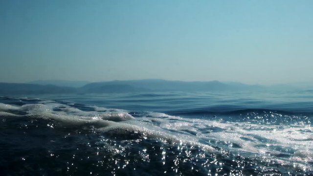 Sea level from moving glass boat. Prores 422 10 Bit slow motion.