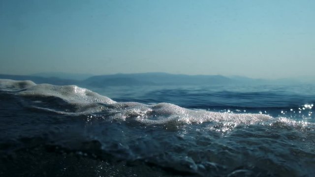 Sea level from moving glass boat. Prores 422 10 Bit slow motion.