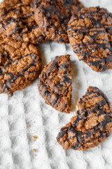 Delicious oatmeal cookies with chocolate on on a white napkin background. Copy, empty space for text