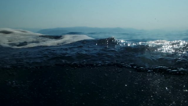 Sea level from moving glass boat. Prores 422 10 Bit slow motion.
