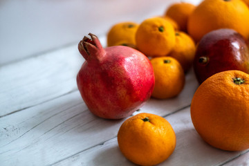 Fruit. Orange, pomegranate, mandarin, mango. Fruit on a white background. Eco-friendly fruits, zero waste.