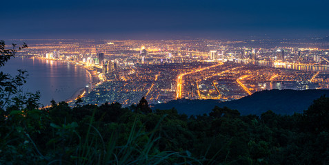 Obraz premium Da Nang City as seen from Ban Co Peak viewpoint at night, Vietnam.