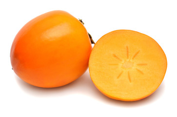 Persimmon fruit whole and half isolated on a white background. Perfectly retouched, full depth of field on the photo. Top view, flat lay