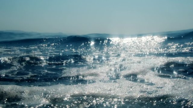 Sea level from moving glass boat. Prores 422 10 Bit slow motion.