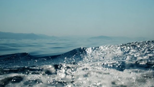 Sea level from moving glass boat. Prores 422 10 Bit slow motion.