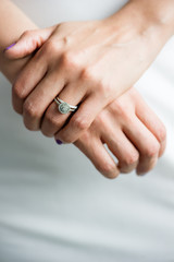 wedding rings on hands of bride