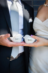 Mr and Mrs wedding doves in bride and grooms hands
