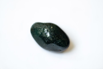 Multi-colored polished stones and minerals. Treated minerals and stones. Isolated minerals and stones: violet, green, beige, pink, orange, blue, beige.