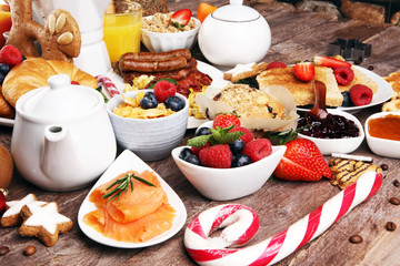 Breakfast served with coffee, orange juice, croissants, cereals and fruits. Balanced diet. Continental breakfast on christmas