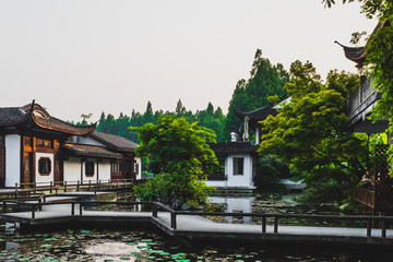 Fototapeta premium Traditional Chinese architecture by water by West Lake, Hangzhou, China