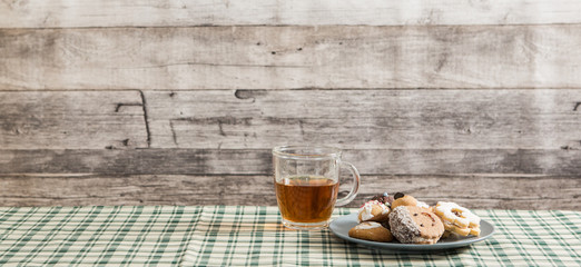 Festive time with home made cookies on the wodden table with wooden background