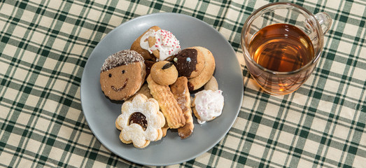 Festive time with home made cookies on the wodden table with wooden background