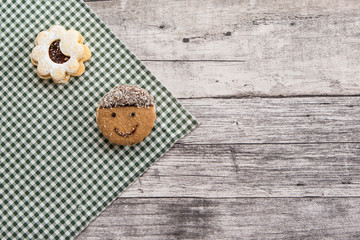 Festive time with home made cookies on the wodden table with wooden background