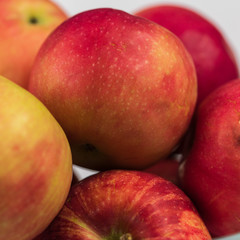 Apples in a clear glass bowl. 