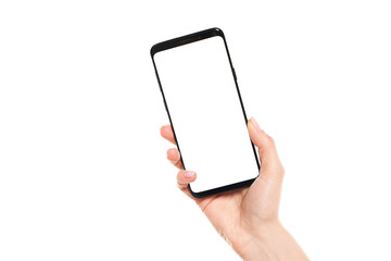Woman hands holding the black smartphone blank screen with modern frameless design isolated on white background