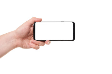 Man hand holding the black smartphone blank screen with modern frameless design isolated on white background