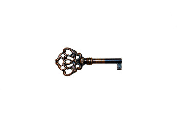 old copper key on white background