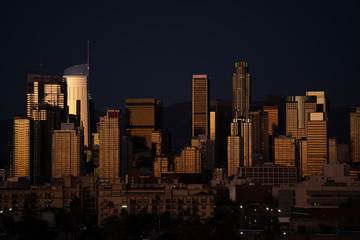 Fototapeta premium Close up night view of downtown Los Angeles skyscrapers reflecting light