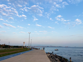 Fishermen fishing at sunset on the shores of the Sea of Marmara in Istanbul Turkey