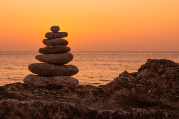 Zen concept. The object of the stones on the beach at sunset. Harmony & Meditation. Zen stones.