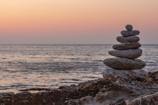 Zen concept. The object of the stones on the beach at sunset. Harmony & Meditation. Zen stones.
