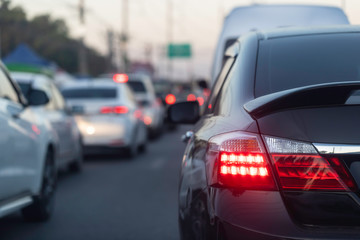 Back light black car on street road traffic transport.