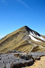 Magnificent view point of a snowy volcanic mountain during spring